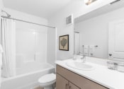 Thumbnail 22 of 42 - a bathroom with a sink and a shower and a toilet
