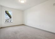 Thumbnail 18 of 43 - A white wall with a picture of a tree on it.
