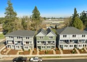 Thumbnail 38 of 42 - an aerial view of a group of houses with cars parked in front of them