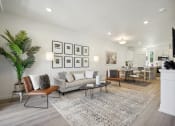 Thumbnail 1 of 42 - a living room with a couch and a table