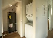 Thumbnail 35 of 55 - A room with a white cabinet and a wall-mounted oven.