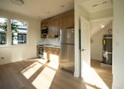 Thumbnail 36 of 55 - A kitchen with wooden cabinets and a white refrigerator.