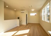 Thumbnail 40 of 55 - A room with wooden floors and a window.