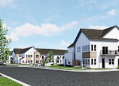 Thumbnail 31 of 31 - A row of houses with a person walking in front of the first house at The Daniels at Northern Gateway Apartments, Saukville 53080