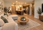 Thumbnail 3 of 16 - A modern living room with a sofa and a coffee table.