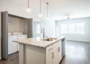 Thumbnail 9 of 24 - Kitchen And Laundry View at The TROTTA, Middleton