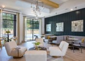 Thumbnail 19 of 46 - a living room filled with furniture and a chandelier