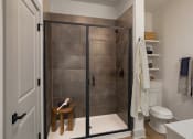 Thumbnail 28 of 40 - a bathroom with a shower and a toilet