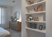 Thumbnail 30 of 40 - a bedroom with white shelves and a bed and a dresser