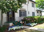 Thumbnail 16 of 18 - a white house with black shutters and a tree in front of it at Avondale Station Apartments, Georgia