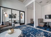 Thumbnail 8 of 78 - a living room with a couch and a table at Altis Blue Lake, Florida, 33467