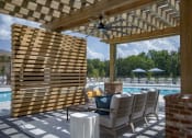 Thumbnail 33 of 46 - a pergola with a pool in the background