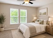 Thumbnail 16 of 71 - A bedroom with bed and painting with double window natural lighting