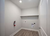 Thumbnail 65 of 67 - laundry room with a fire extinguisher on the wall