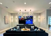 Thumbnail 15 of 29 - a large living room with a couch and a tv