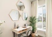 Thumbnail 26 of 60 - a home office with a desk and a window