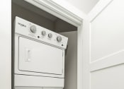 Thumbnail 47 of 60 - a washer and dryer in a closet next to a door