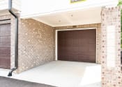 Thumbnail 55 of 60 - a lobby of a building with two brown doors