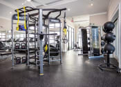 Thumbnail 6 of 60 - the gym with weights and other equipment at the flats
