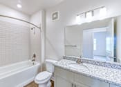 Thumbnail 36 of 40 - a bathroom with a sink toilet and tub and a mirror