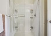 Thumbnail 14 of 42 - A white bathroom with a walk in shower.