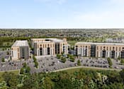 Thumbnail 2 of 5 - A large building complex with a parking lot in front.