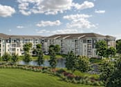 Thumbnail 7 of 7 - A large building complex with a pond in front.