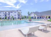 Thumbnail 50 of 60 - our apartments have a resort style pool and lounge chairs