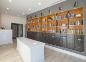 Thumbnail 34 of 40 - the lobby of a library with a desk and lockers