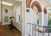 Thumbnail 20 of 28 - A hallway with a brick archway and a sign that says "ENTRY".