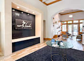 Thumbnail 9 of 31 - A reception area with a glass table and chairs.