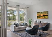 Thumbnail 10 of 49 - a living room with a couch and two chairs