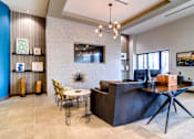 Thumbnail 18 of 26 - a living room with a bar and a dining room