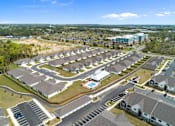 Thumbnail 53 of 53 - an aerial view of a group of houses in a parking lot