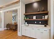 Thumbnail 36 of 53 - a rendering of a kitchen with white cabinets and a wood floor