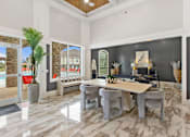 Thumbnail 7 of 53 - a dining room with a table and chairs