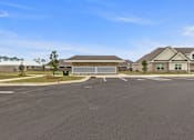 Thumbnail 27 of 53 - an empty parking lot in front of a house