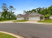 Thumbnail 51 of 53 - a house with a driveway and a street in front of it