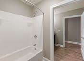 Thumbnail 22 of 53 - the preserve at ballantyne commons apartment bathroom with tub and walk in shower