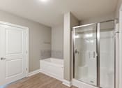 Thumbnail 20 of 53 - a white bathroom with white tiled walls and floors