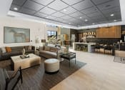 Thumbnail 9 of 94 - a lobby with couches and chairs and a bar and a living room