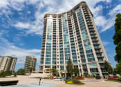 Thumbnail 1 of 44 - an image of a tall building with a blue sky in the background