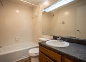 Thumbnail 14 of 16 - a bathroom with a sink toilet and bathtub
