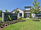 Thumbnail 48 of 49 - A sign for ASTER in front of a building.