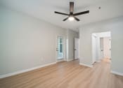 Thumbnail 49 of 59 - a living room with wood floors and a ceiling fan