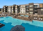 Thumbnail 39 of 94 - a rendering of an apartment building with a swimming pool