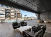 Thumbnail 45 of 94 - a large patio with chairs and tables and a pool