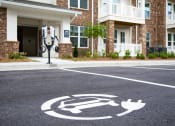 Thumbnail 38 of 46 - a symbol of a wheelchair in a parking lot in front of a building