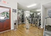 Thumbnail 19 of 28 - Apartments in Atlanta GA with In-Unit Washer and Dryer - Virginia Highlands - Fitness Center with Cardio Machines, Strength-Training Equipment, and Mirrored Walls.