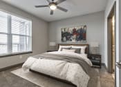Thumbnail 15 of 25 - a bedroom with a bed and a ceiling fan